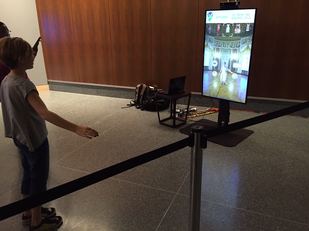 Smithsonian visitor trying Zugara Virtual Dressing Room technology